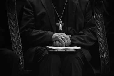 Catholic Priest Sitting in Choir