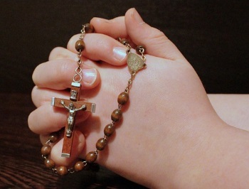 Catholic Investor Praying Rosary to Find USCCB Compliant Investment Advisor