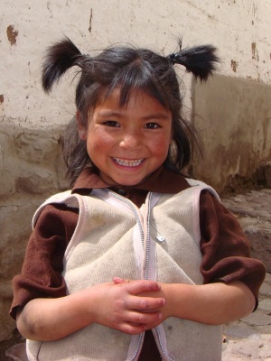 Peruvian Girl Happy after Catholic Impact Investing Improves Environment